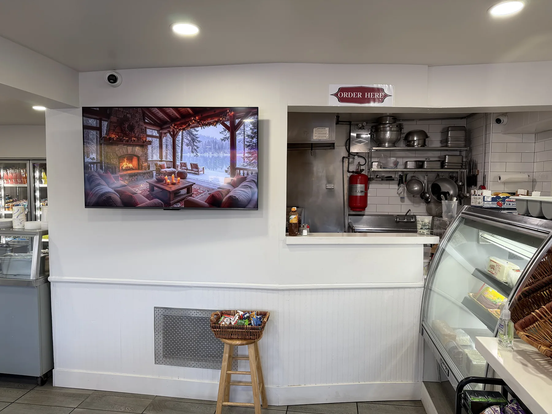 Commercial wall display showing digital content in a cafe
