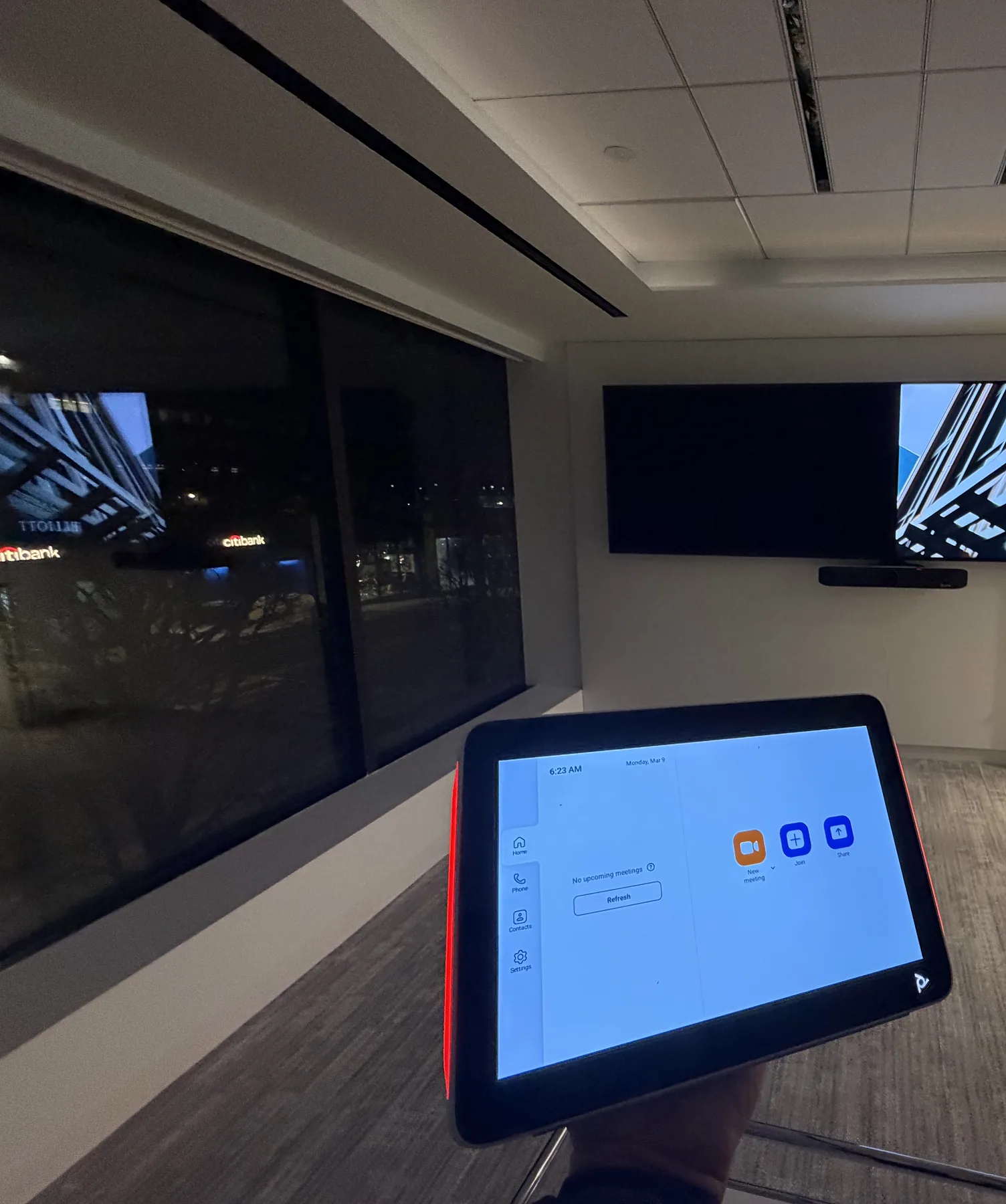 Zoom Rooms touch controller with dual displays and video conferencing bar