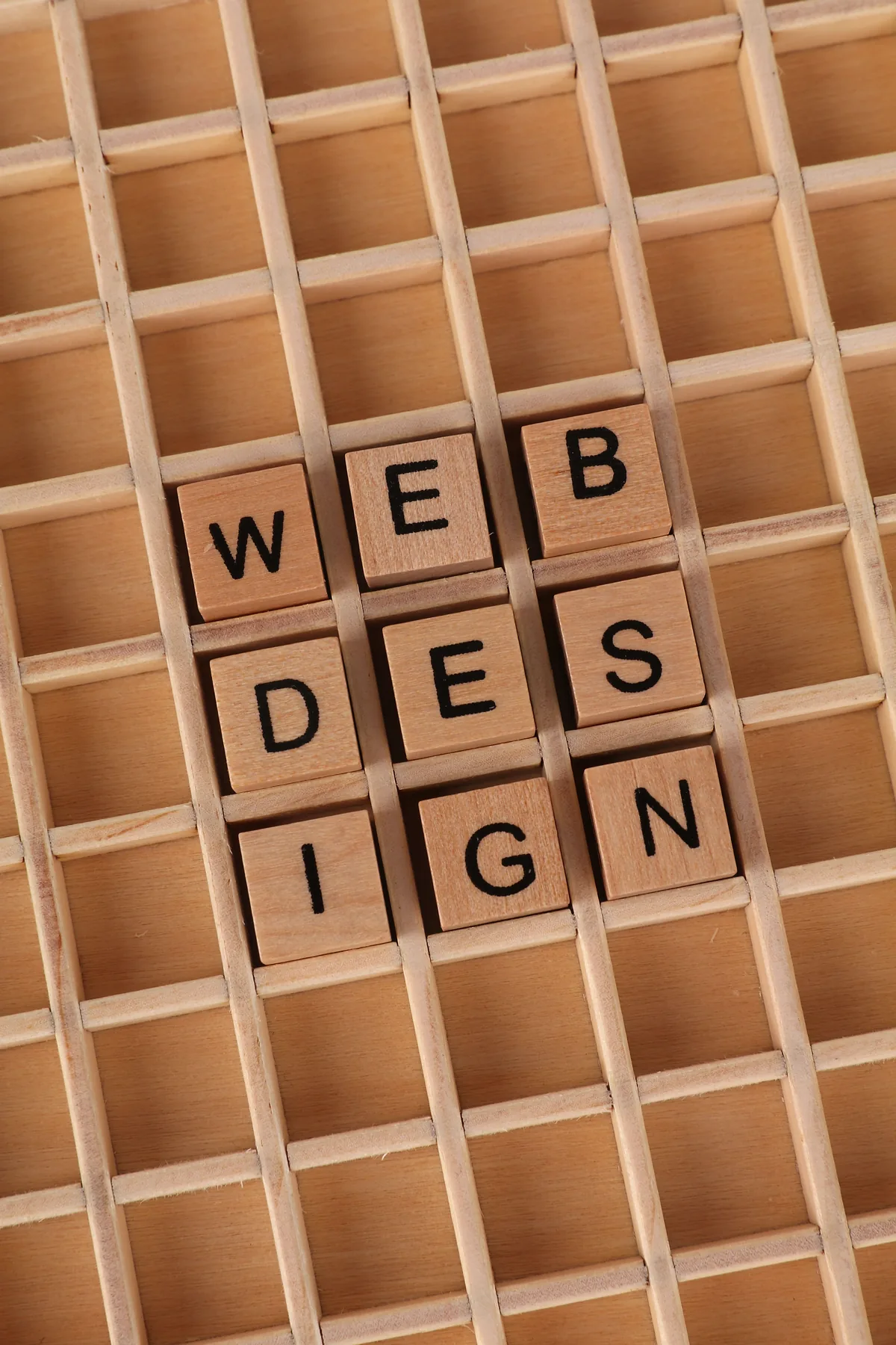Wooden letter blocks spelling WEB DESIGN