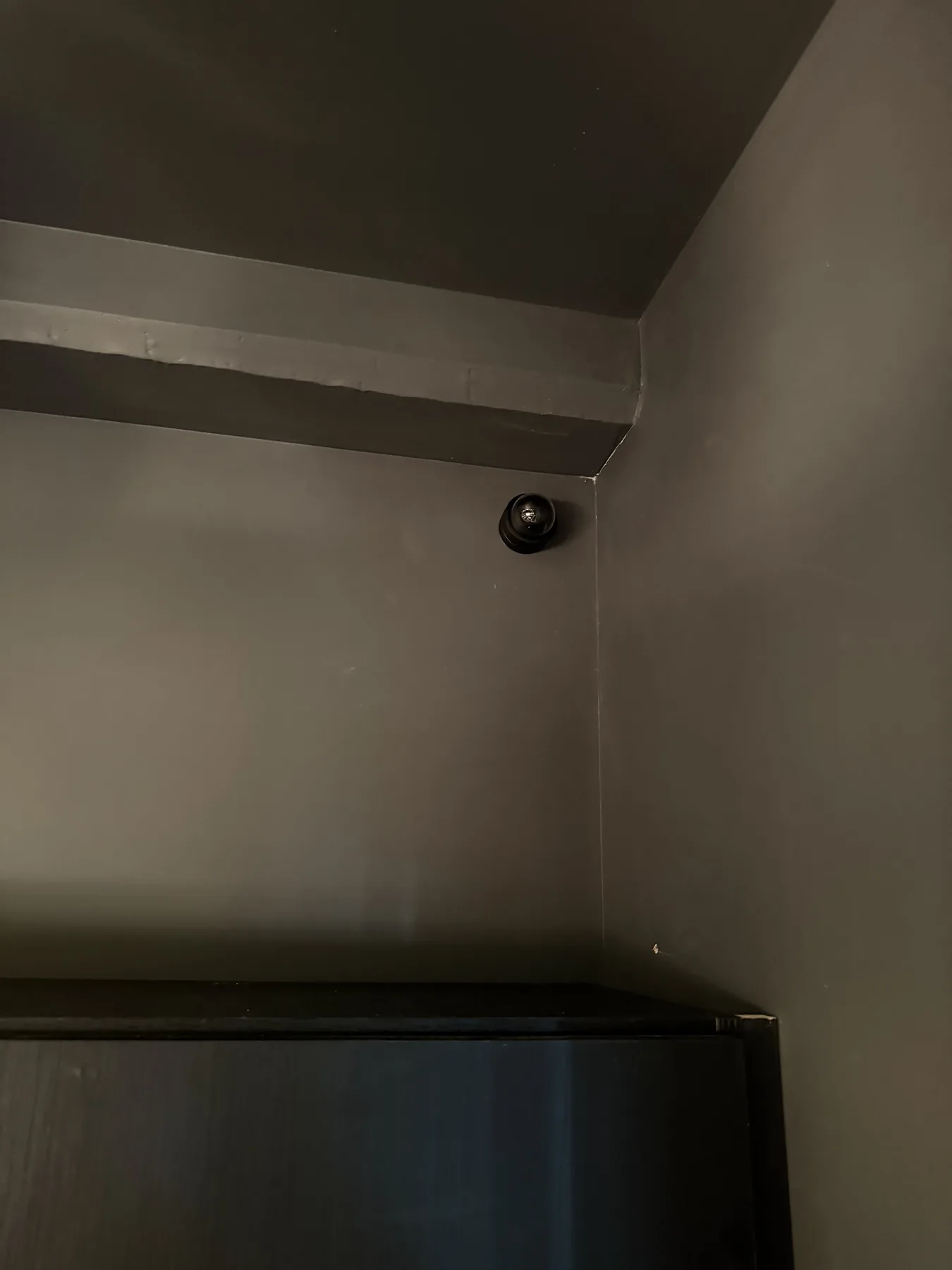 Dome security camera mounted at a ceiling corner