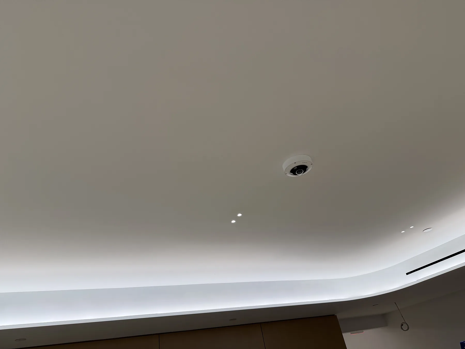 Ceiling-mounted sensor with recessed cove lighting