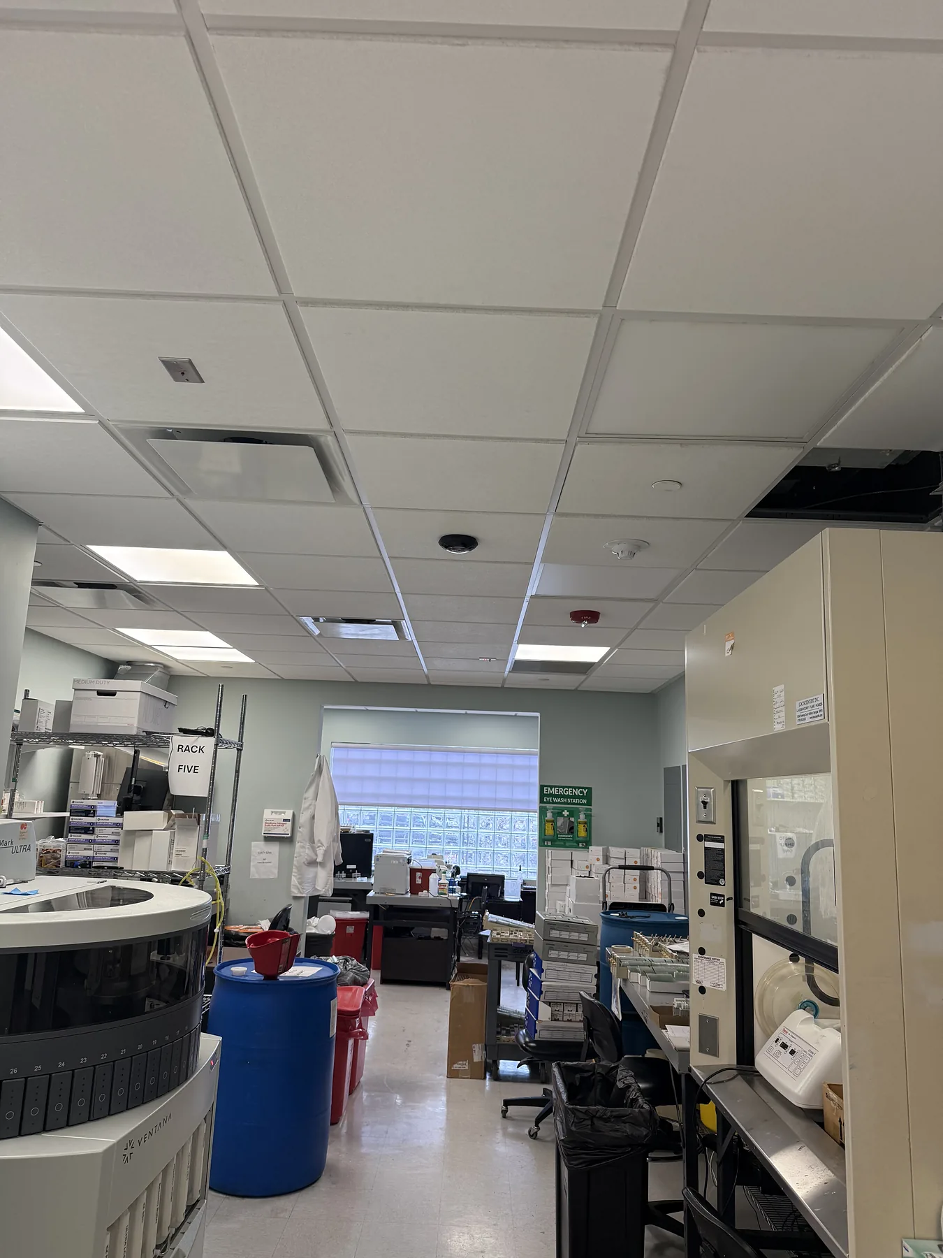 Office lab space with multiple ceiling-mounted circular sensors