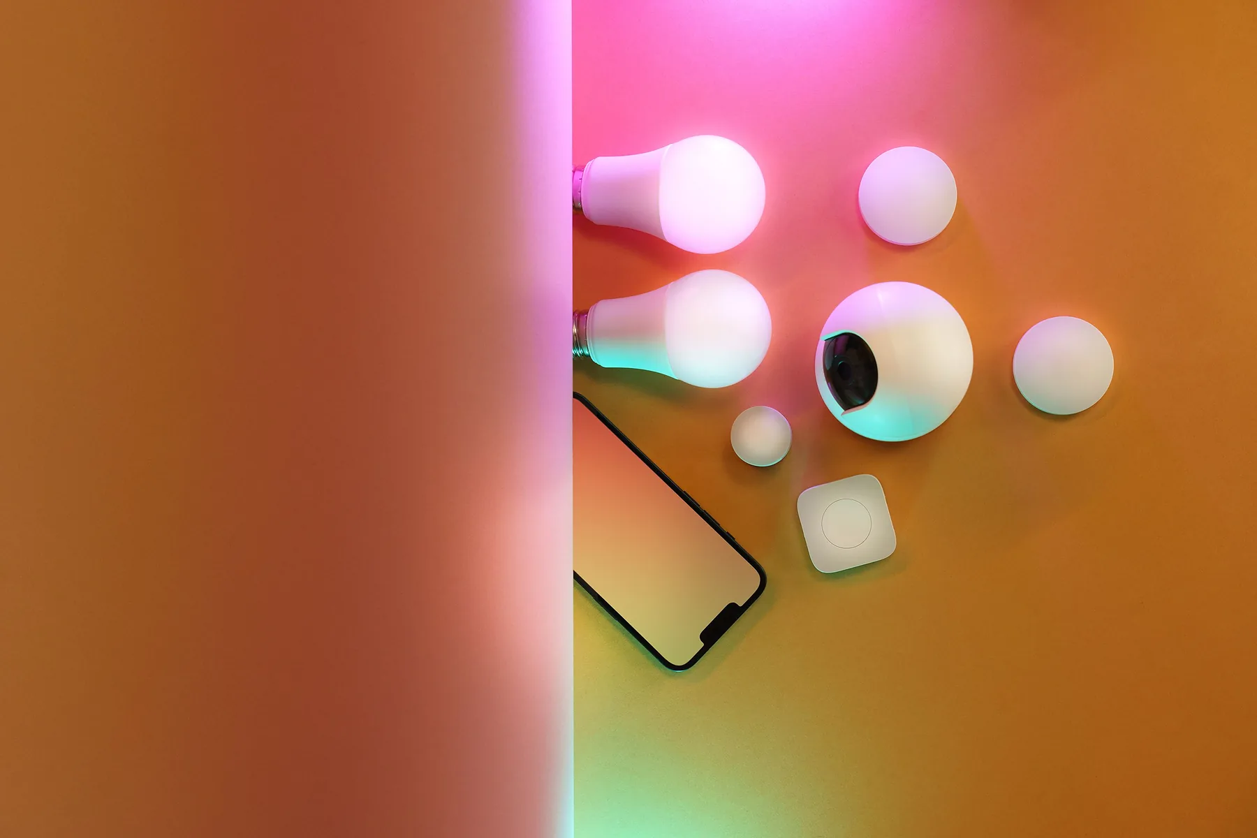 Smart home sensors and bulbs casting colored light